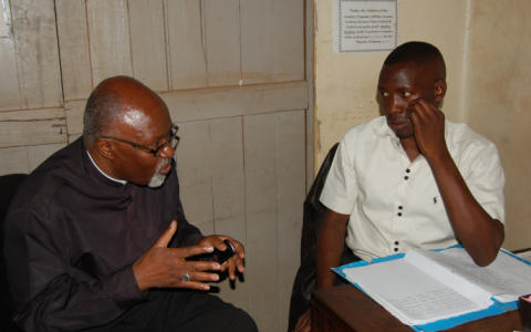 Humiliation: Bishop Zac at the police station. Photo: Daily Monitor