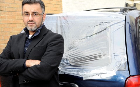 Farooq Siddique with his vandalised car. Photo: Matthew Lloyd Farooq Siddique with his vandalised car. Photo: Matthew Lloyd