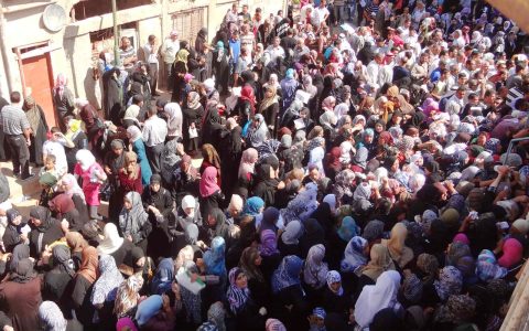 Displaced Syrians waiting to register for aid at an Orthodox church. Photo: IOCC/GOPA Displaced Syrians waiting to register for aid at an Orthodox church. Photo: IOCC/GOPA