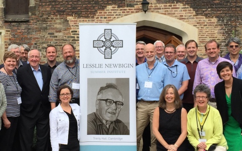 Founders Paul Weston (right of banner) and Scot Sherman (left of banner) outside Trinity Hall, Cambridge last week.
